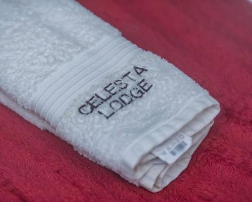 a white towel with the words best days written on it at Large Room with Free Breakfast in Lubumbashi