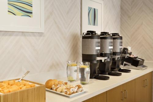 a coffee machine sitting on top of a counter at SpringHill Suites by Marriott Allentown Bethlehem/Center Valley in Center Valley