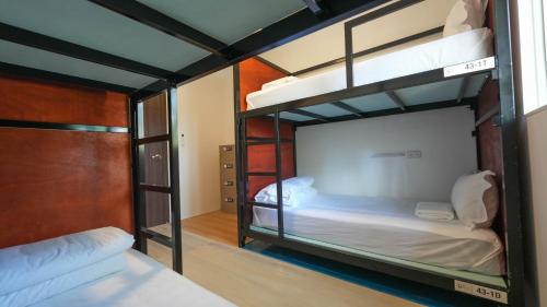 Postel nebo postele na pokoji v ubytování Green Gen Hotel, Mueang Phuket