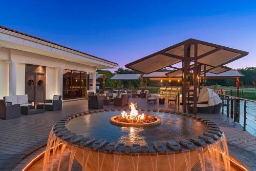 a fire pit in the middle of a patio at The Westin Reserva Conchal, an All-Inclusive Golf Resort & Spa in Playa Conchal