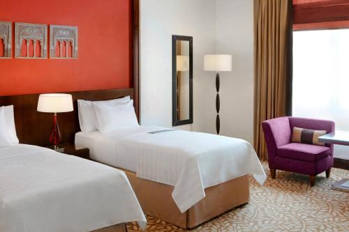 Postel nebo postele na pokoji v ubytování Le Meridien Towers Makkah