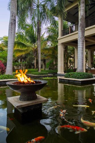 a fire fountain in a pond in a resort at St. Regis Bahia Beach Resort, Puerto Rico in Rio Grande