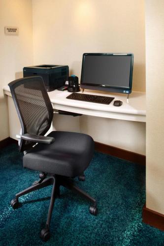 a desk with a laptop computer and a chair at SpringHill Suites by Marriott Pittsburgh Washington in Washington