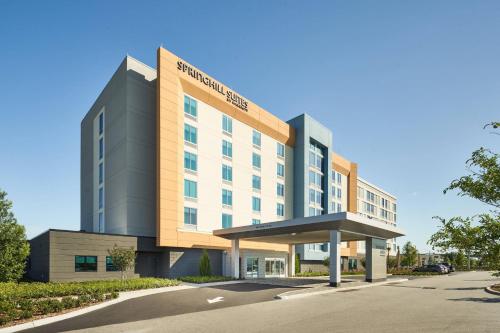 a rendering of the front of a hotel at SpringHill Suites by Marriott Orlando Lake Nona in Orlando