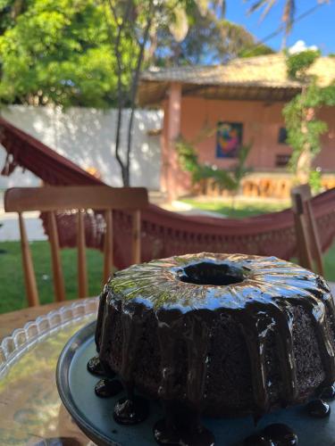 a chocolate cake sitting on top of a table at Pousada Vila Flow in Cumbuco