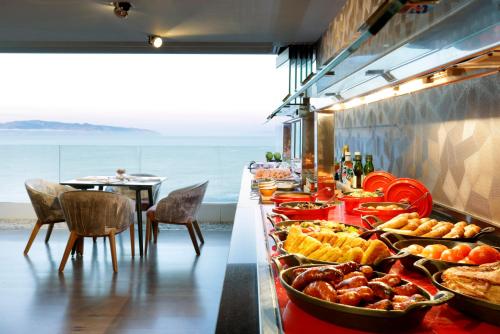 a buffet line with many different types of food at Hard Rock Hotel Tenerife in Adeje