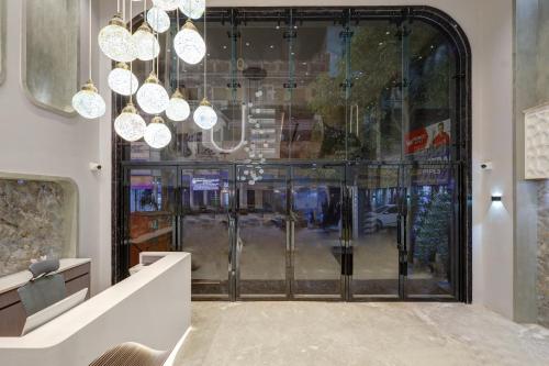 a store front with glass doors and chandeliers at The Viking Hotel- 5 Minutes away from New Delhi Railway & Connaught Place in New Delhi
