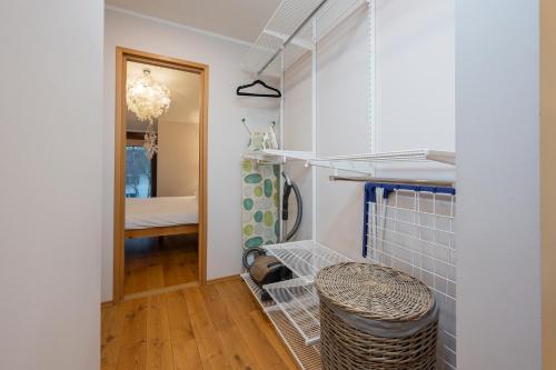 a small room with a hallway with a stool at Modern city center apartment in Tartu