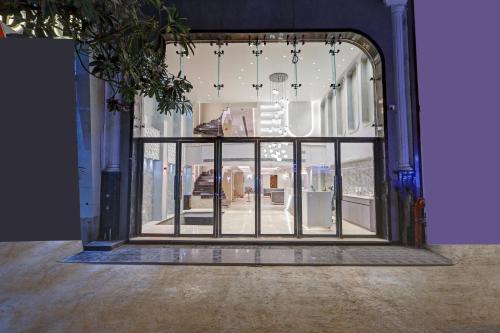 a glass door to a store in a building at The Viking Hotel- 5 Minutes away from New Delhi Railway & Connaught Place in New Delhi