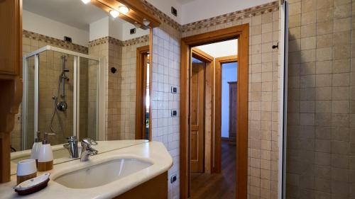 a bathroom with a sink and a shower at Sweet Suite in Sappada