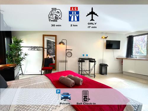 une chambre avec un lit rouge dans une pièce dans l'établissement Les Entrepreneurs - Appartements neufs et spacieux, proche RER C et Aéroport Orly, à Morangis