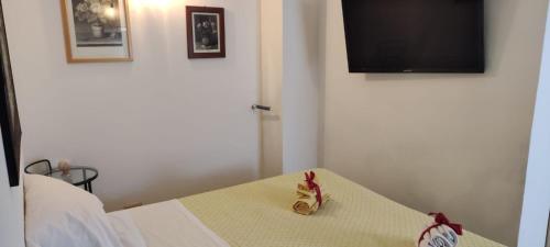 Postel nebo postele na pokoji v ubytování Palazzo Migliaccio Soggiorno