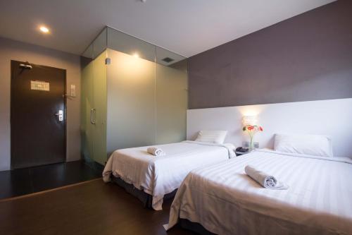Postel nebo postele na pokoji v ubytování Chariton Hotel Ipoh