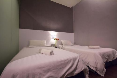 Chariton Hotel Ipohにあるベッド