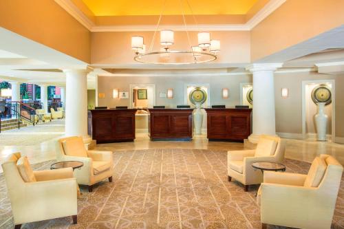 a large lobby with chairs and a chandelier at Sheraton Orlando North in Orlando