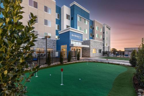a rendering of a building with a golf course at Residence Inn by Marriott Anderson Clemson in Anderson