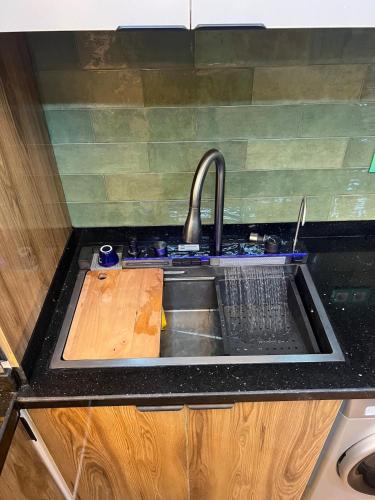 a kitchen counter with a sink and a sink at Vintage Green House in Fez