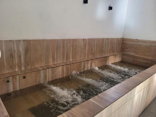 a bathtub filled with water in a room at Tierras Blancas Nihuil in El Nihuil