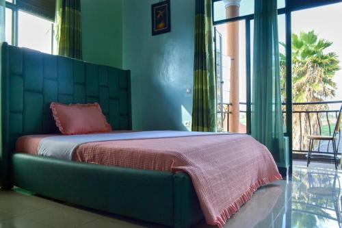 Una cama o camas en una habitación de Umugano Villa