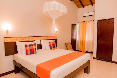 Postel nebo postele na pokoji v ubytování Gimanhala Hotel