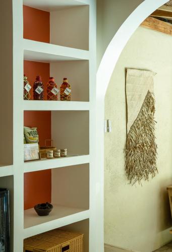 a room with shelves with vases on the wall at Villa design avec piscine privée à El Nido in El Nido