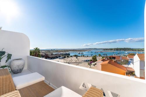 a balcony with a view of the ocean at Alvor River & Sea View I in Alvor