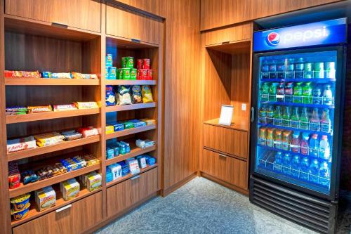 a refrigerator in a store with lots of drinks at Fairfield Inn & Suites by Marriott Ottawa Airport in Ottawa