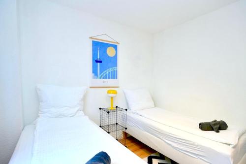 Postel nebo postele na pokoji v ubytování Hippes Apartment im Herzen Kölns
