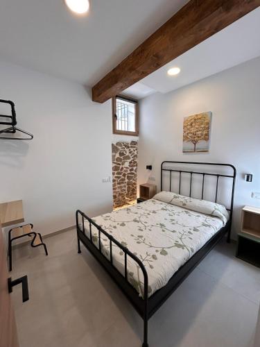 a bedroom with a bed in a room with a window at Apartamento La Fragua - A ESTRENAR - BRAND NEW in Chulilla