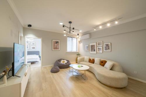 a living room with a couch and a table at Book and Bed-People's Square in Shanghai