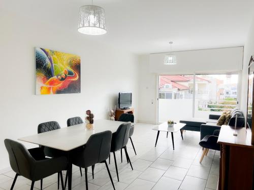 a dining room with a table and chairs at Samos City Center, 2BR Sleeps 4 in Limassol