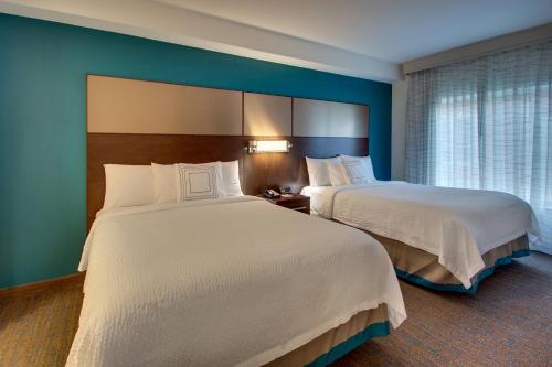 a hotel room with two beds and a window at Residence Inn by Marriott Philadelphia Valley Forge/Collegeville in Collegeville