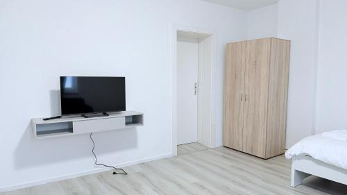 Μια τηλεόραση ή/και κέντρο ψυχαγωγίας στο ProStay Apartments - nahe Itzehoe