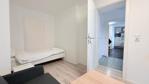Ένα ή περισσότερα κρεβάτια σε δωμάτιο στο ProStay Apartments - nahe Itzehoe