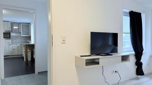 Μια τηλεόραση ή/και κέντρο ψυχαγωγίας στο ProStay Apartments - nahe Itzehoe