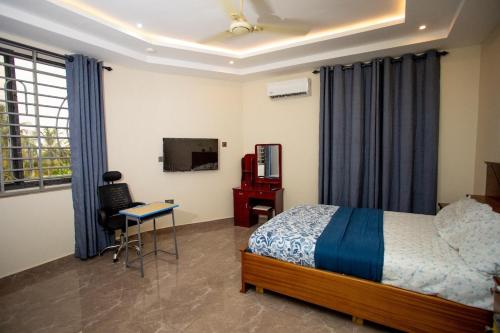 Ένα ή περισσότερα κρεβάτια σε δωμάτιο στο 4 Bedroom Apartment North Legon