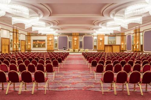 an empty conference room with chairs and a podium at The Westin Zagreb in Zagreb