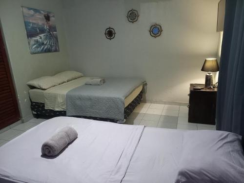 Un ou plusieurs lits dans un hébergement de l'établissement Apartahotel los cactus