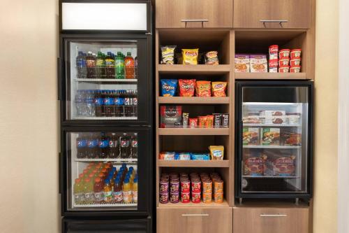 a refrigerator filled with lots of drinks and soda at Residence Inn Deptford in Almonesson