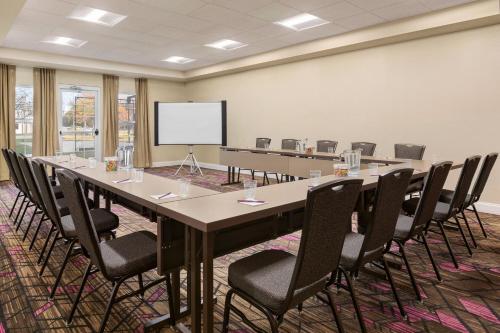 a conference room with a long table and chairs at Residence Inn Deptford in Almonesson