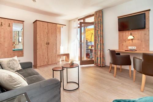 TV a/nebo společenská místnost v ubytování Apparthotel Minerva Diana Octavia