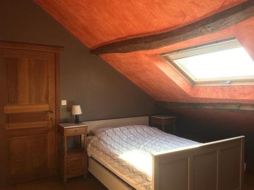 Postel nebo postele na pokoji v ubytování Les Pierrots