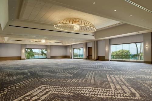an empty ballroom with a large room with large windows at The Ritz-Carlton O'ahu, Turtle Bay in Kahuku