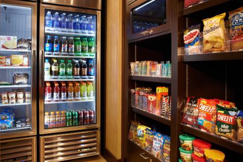 a refrigerator filled with lots of different types of drinks at Residence Inn by Marriott Ann Arbor North in Ann Arbor