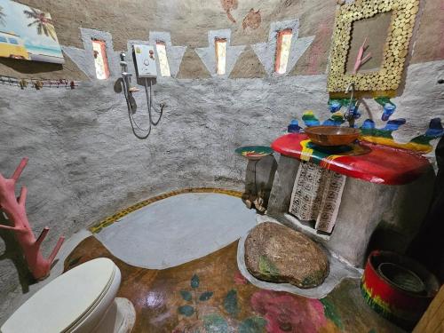 a bathroom with a shower and a toilet in it at Clay House Chiang Mai By Alphatel in Chiang Mai
