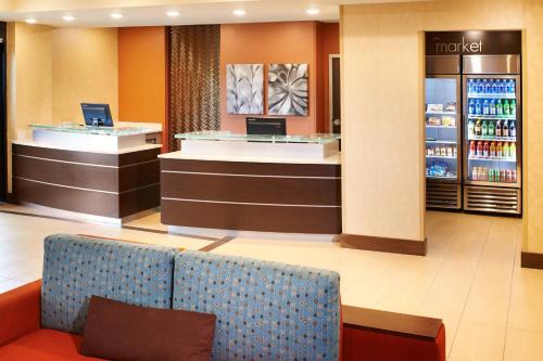 a lobby of a hotel with a couch and a counter at Residence Inn by Marriott Ann Arbor North in Ann Arbor