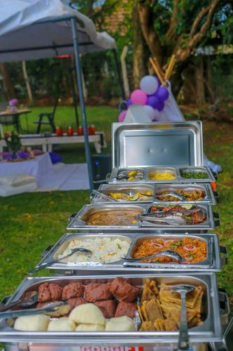 a buffet of food on display at a party at The lit garden place in Kisumu