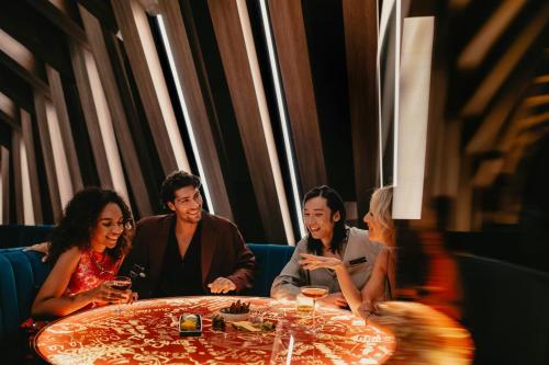 a group of people sitting around a table at W Melbourne in Melbourne
