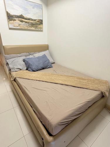 a bed in a corner of a room at DandD's Place Studio Unit 1 with Free Netflix in Davao City