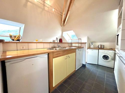 a large kitchen with a sink and a dishwasher at Duplex 70m² 8 pers. à Briançon, proche télécabine, 2 chambres, coin nuit, parking privé - FR-1-330C-1 in Briançon